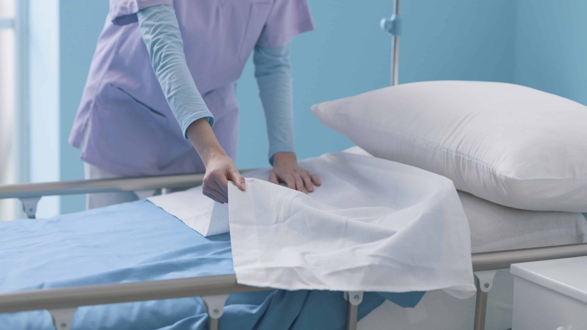expert-young-nurse-making-the-bed-at-the-hospital-2024-10-11-01-50-03-utc (3) (1)